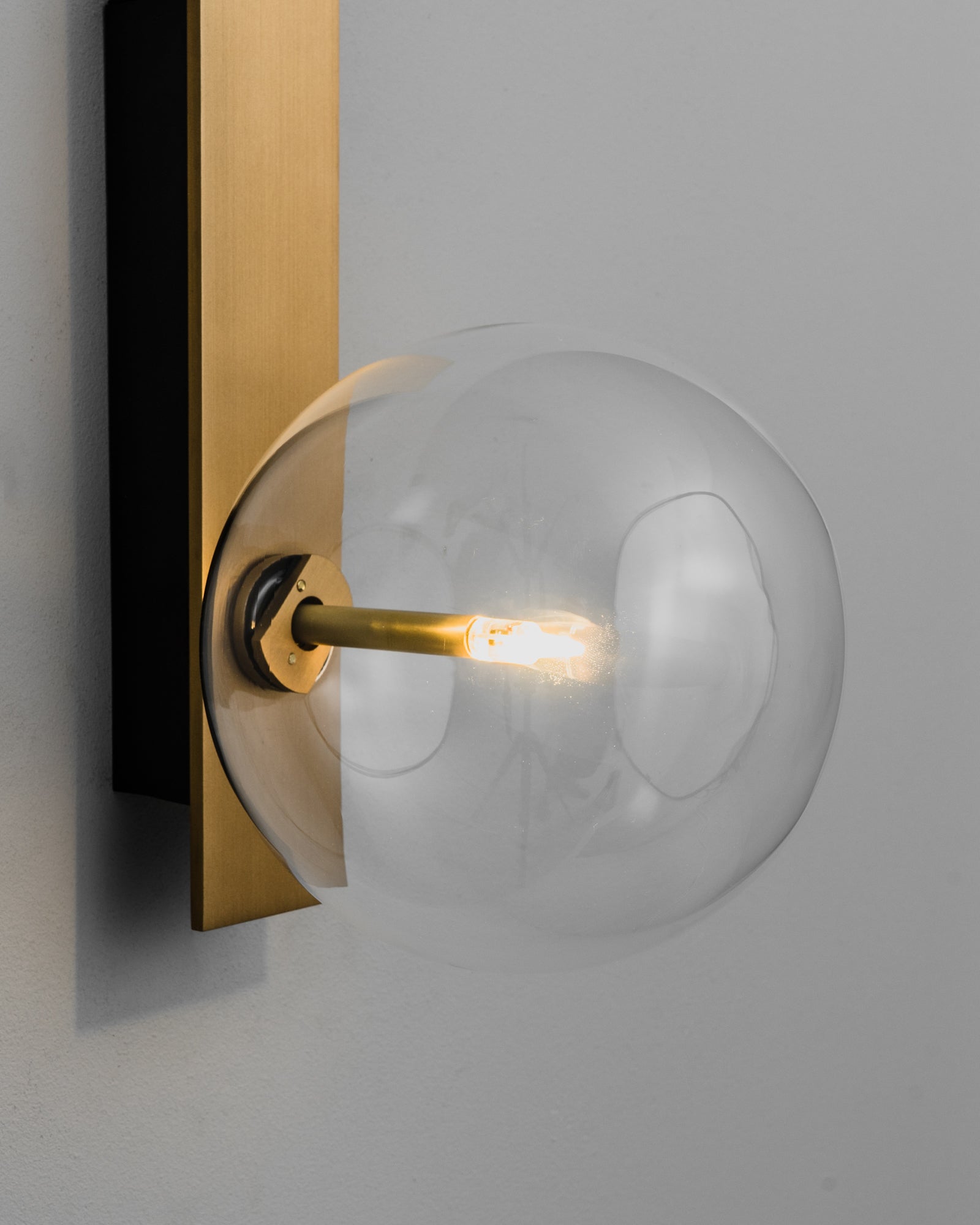 Schwung Oslo Dual Burnished Brass Transparent Globe Wall Light